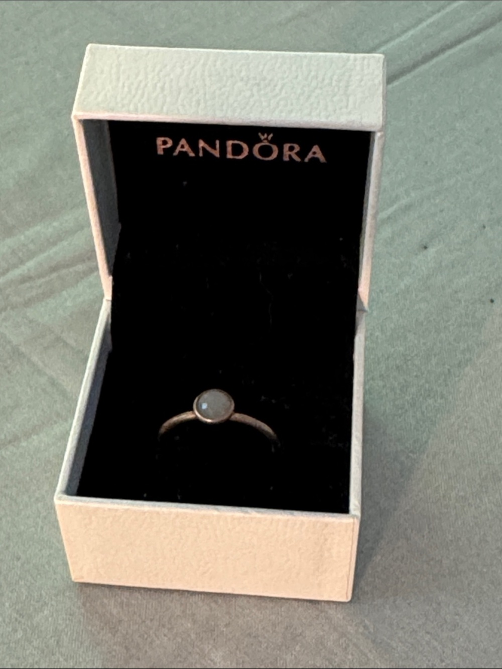 Pandora sterling silver ring with a bezel-set gray moonstone